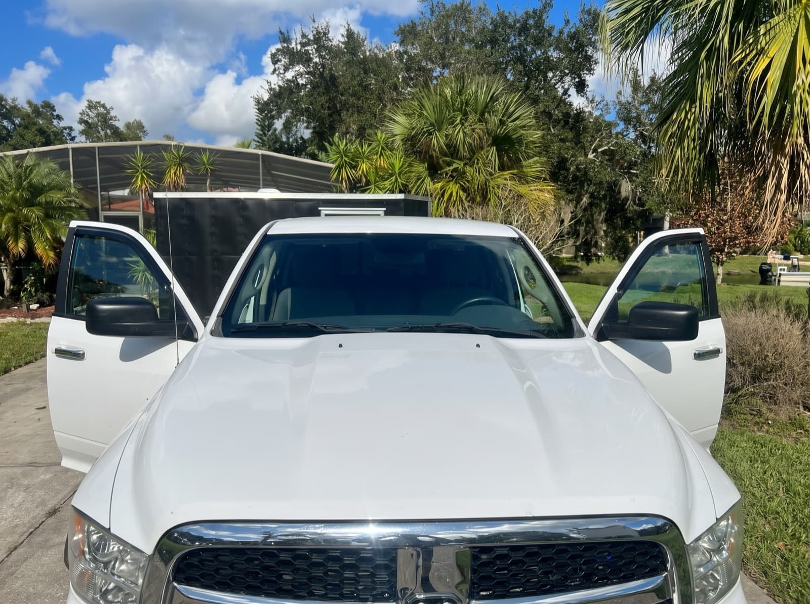 A white pickup truck with its doors open in St. Cloud, FL, after a Bang AutoGlass mobile glass job