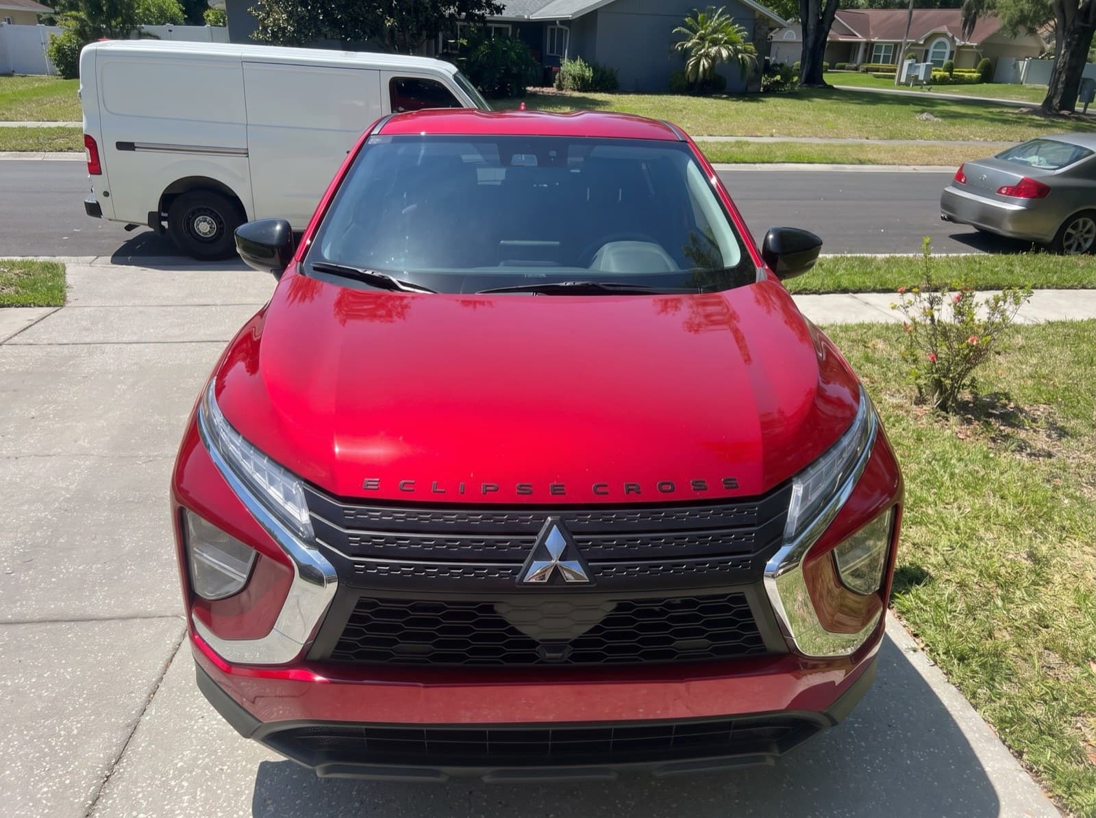 A red compact SUV in a parking lot in Lake Mary, FL, after a Bang AutoGlass mobile glass job